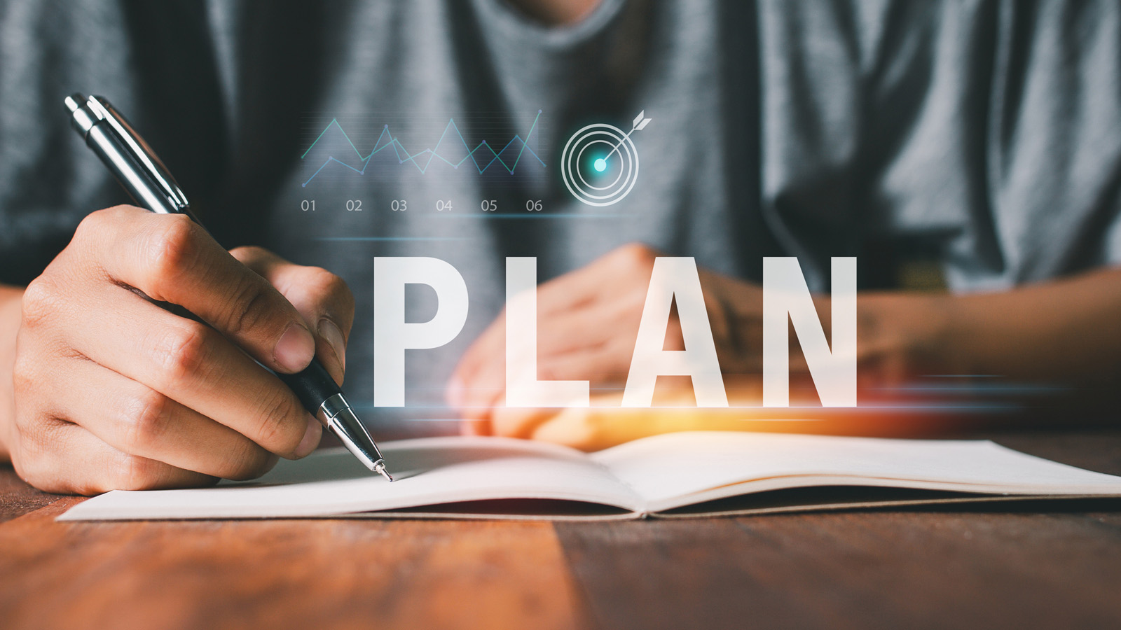 Mapping out a new plan with notebook and pen